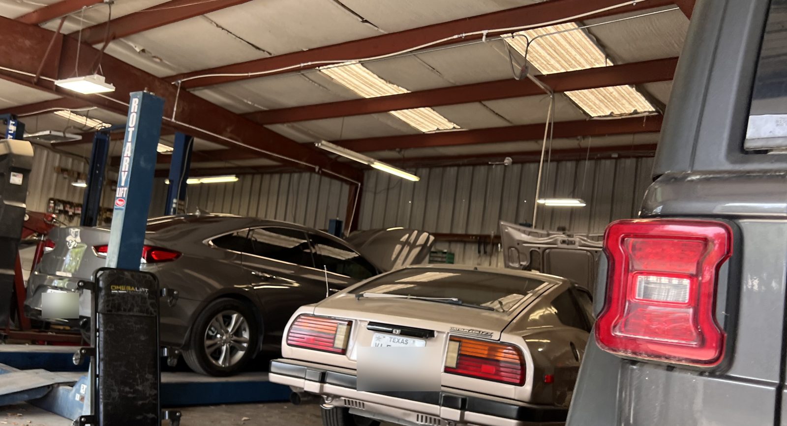 Inside the shop — vehicles in the service bays